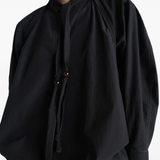 Close up of black top, showing texture of the cotton fabric