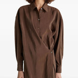 Close up of brown dress, showing texture of the silk abric