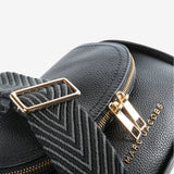 Close up of black bag, showing texture of the leather fabric