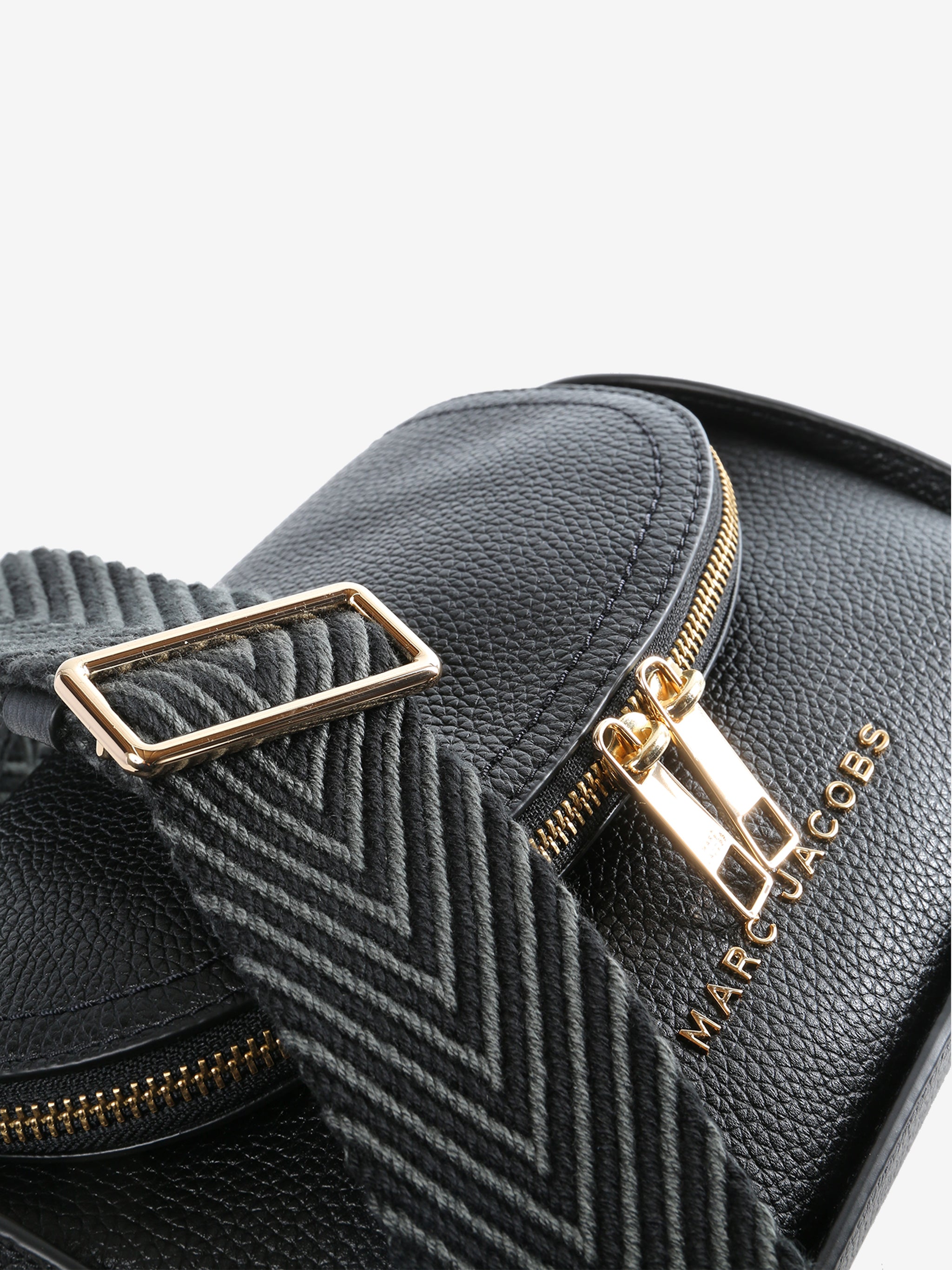 Close up of black bag, showing texture of the leather fabric