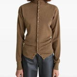 Brown knitwear worn by a person, showing the knitwear's fit