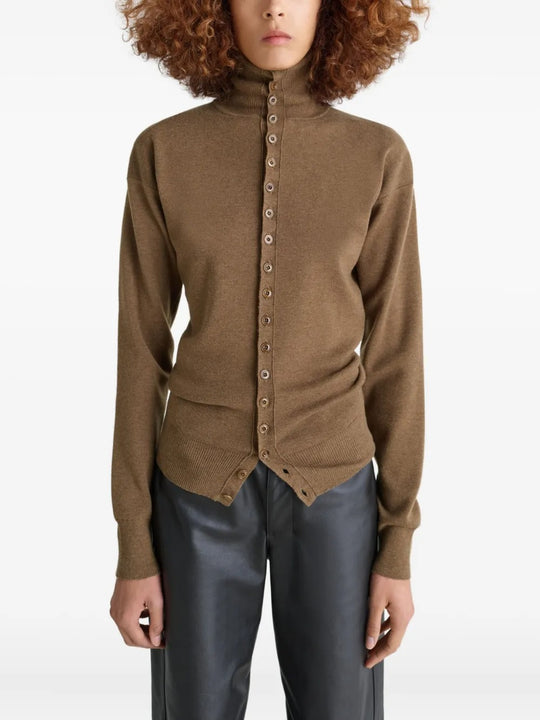 Brown knitwear worn by a person, showing the knitwear's fit