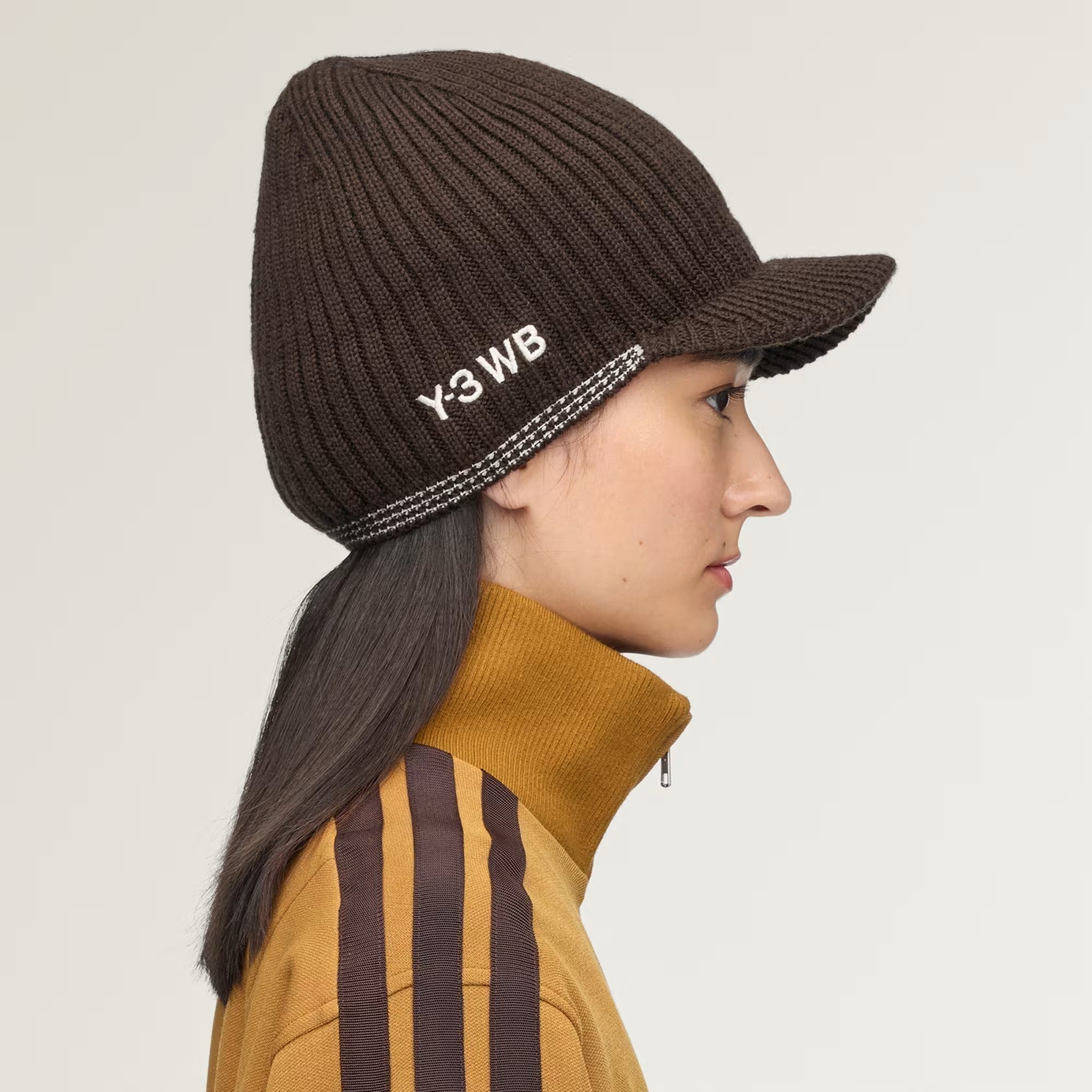 Brown hat worn by a person, showing the hat fit