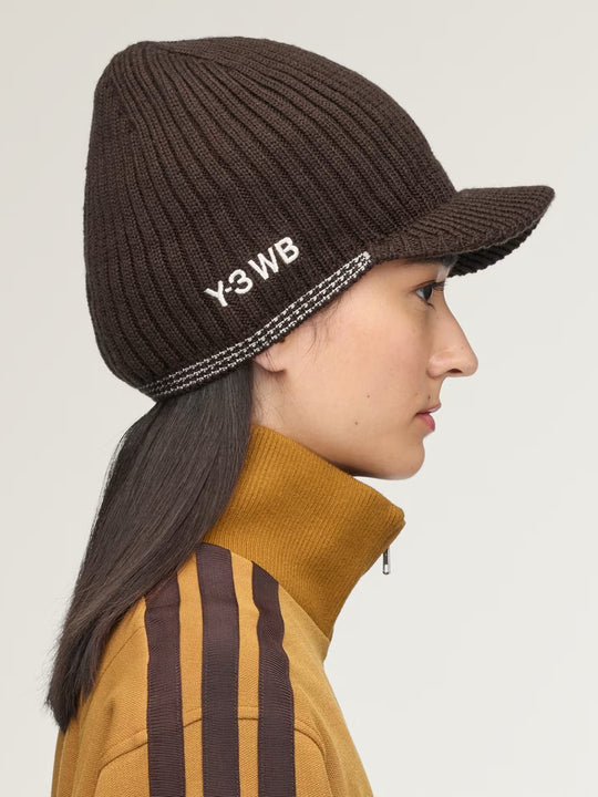 Brown hat worn by a person, showing the hat fit