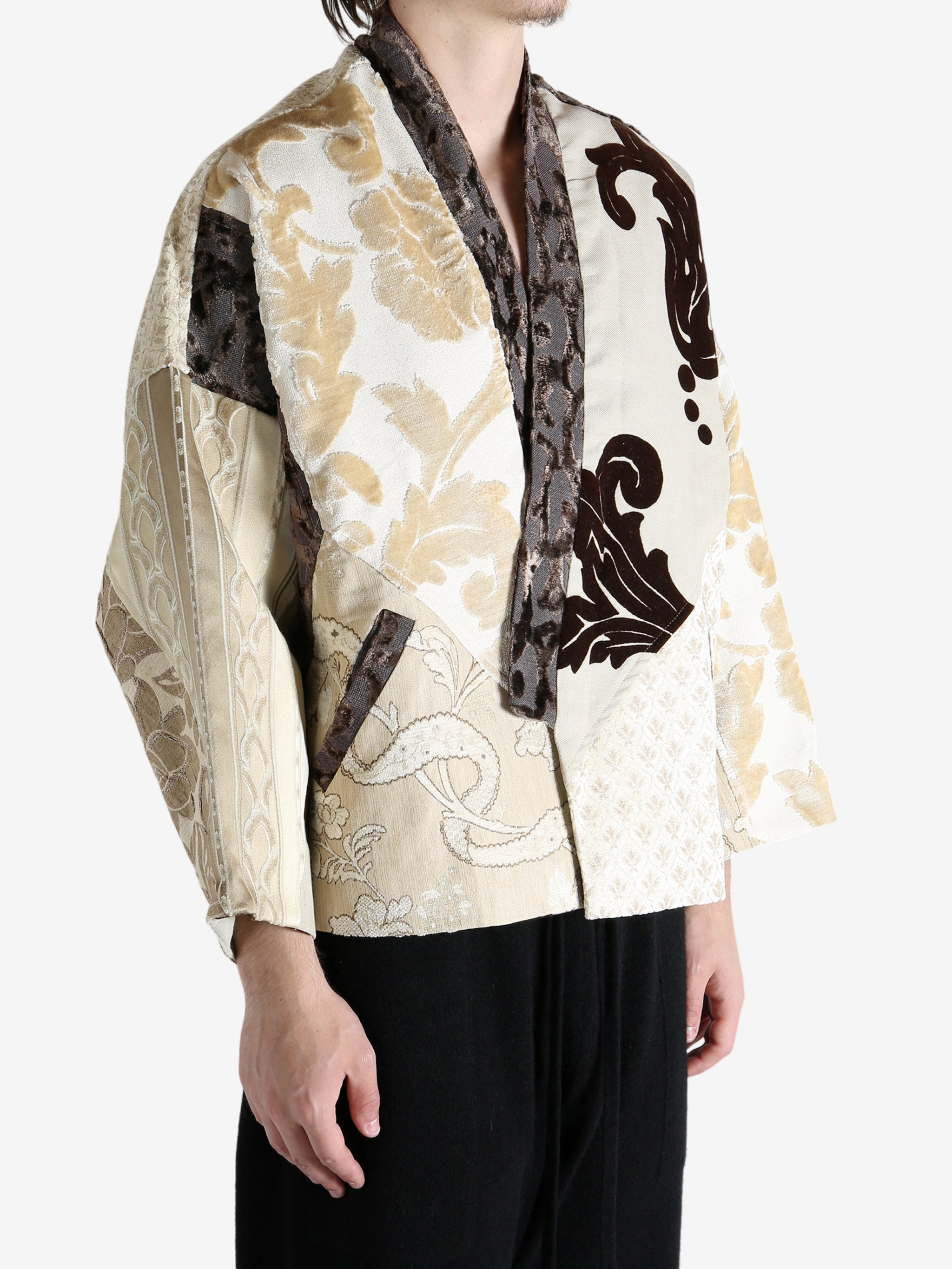 Tan coat worn by a person, showing the coat fit