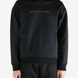 Black hoodie worn by a person, showing the hoodie's fit