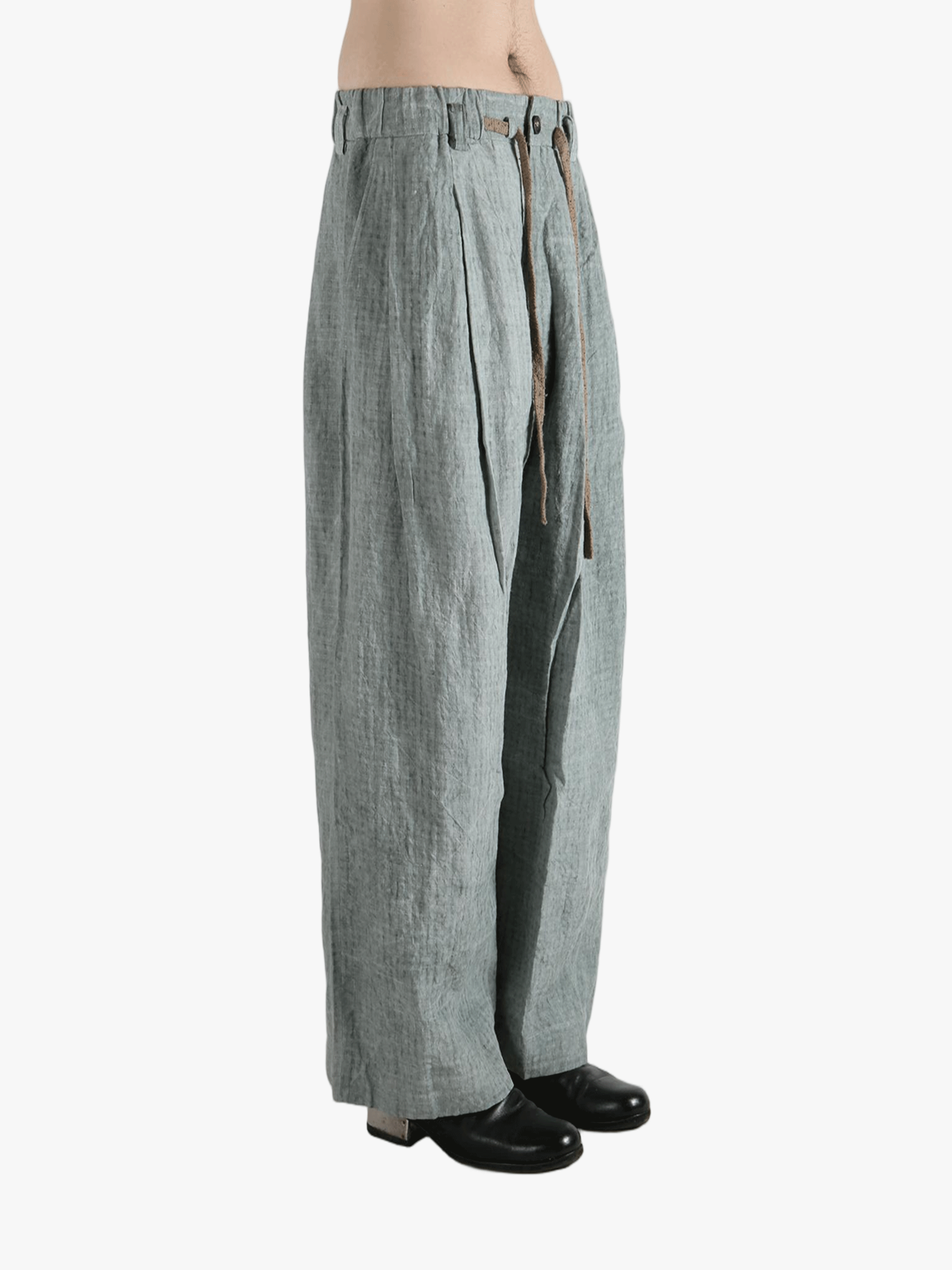 Gray pants worn by a person, showing the pants fit