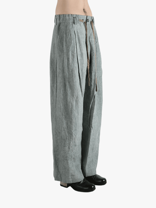 Gray pants worn by a person, showing the pants fit
