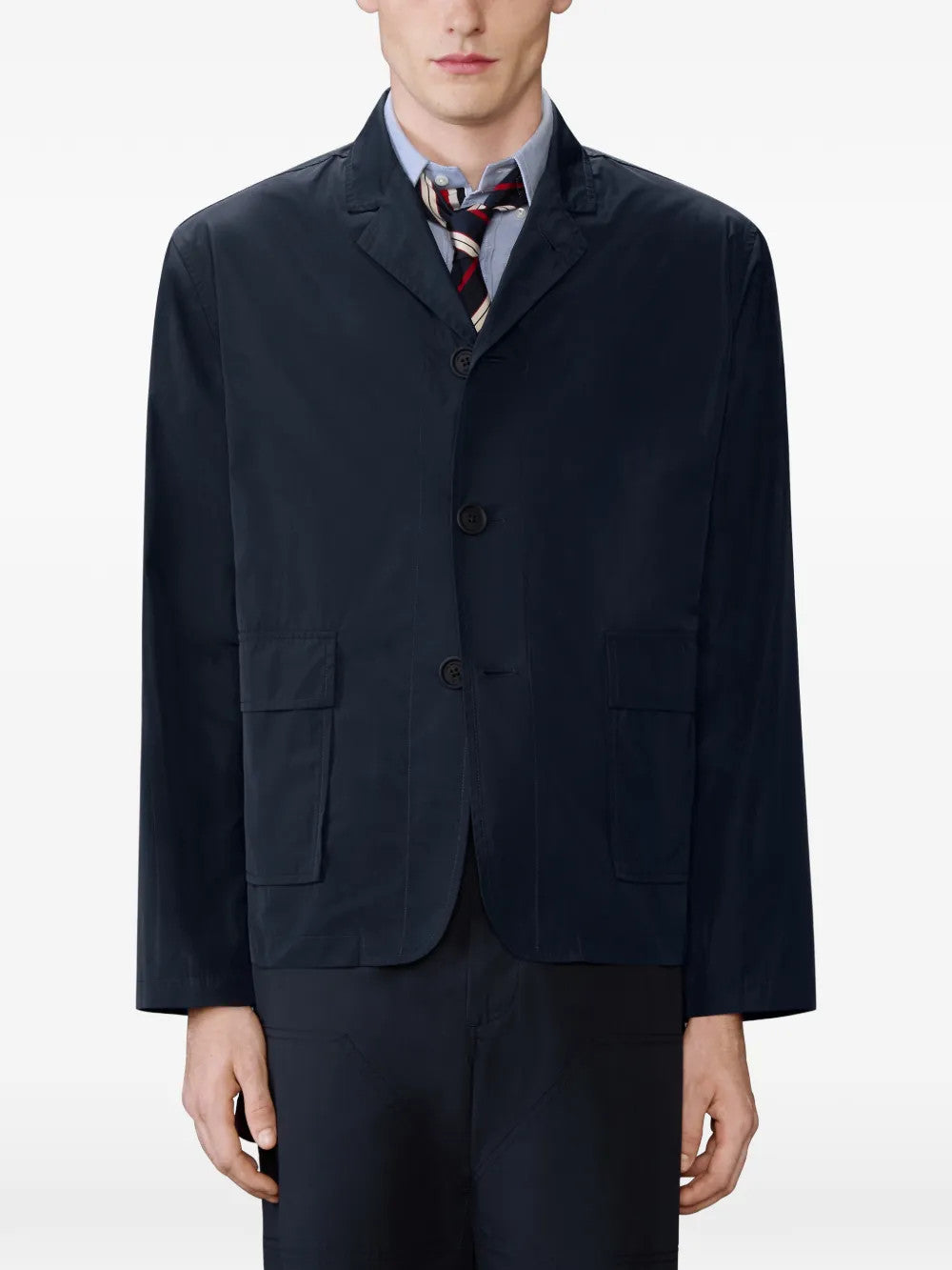 Navy jacket worn by a person, showing the jacket fit