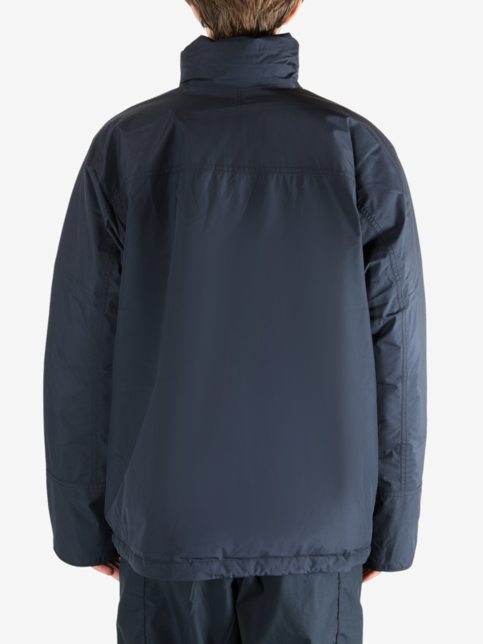 Navy jacket worn by a person, showing the jacket's fit