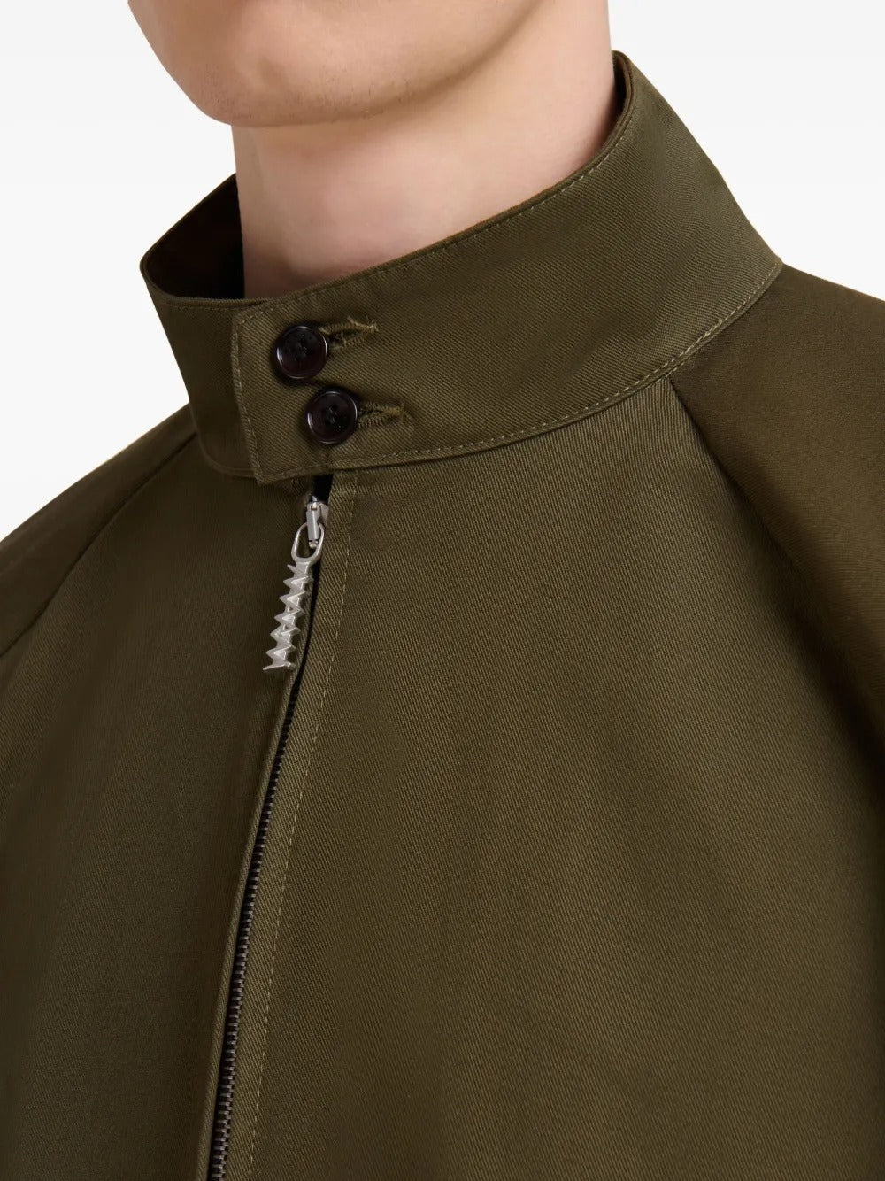 Close up of brown jacket, showing texture of the cotton blend fabric