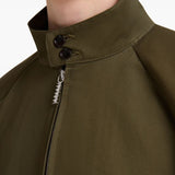 Close up of brown jacket, showing texture of the cotton blend fabric