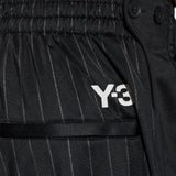 Close up of black pants, showing texture of the recycled polyester fabric