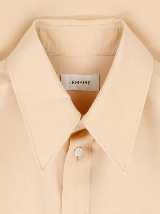 Close up of Tan shirt, showing texture of the 100% silk fabric