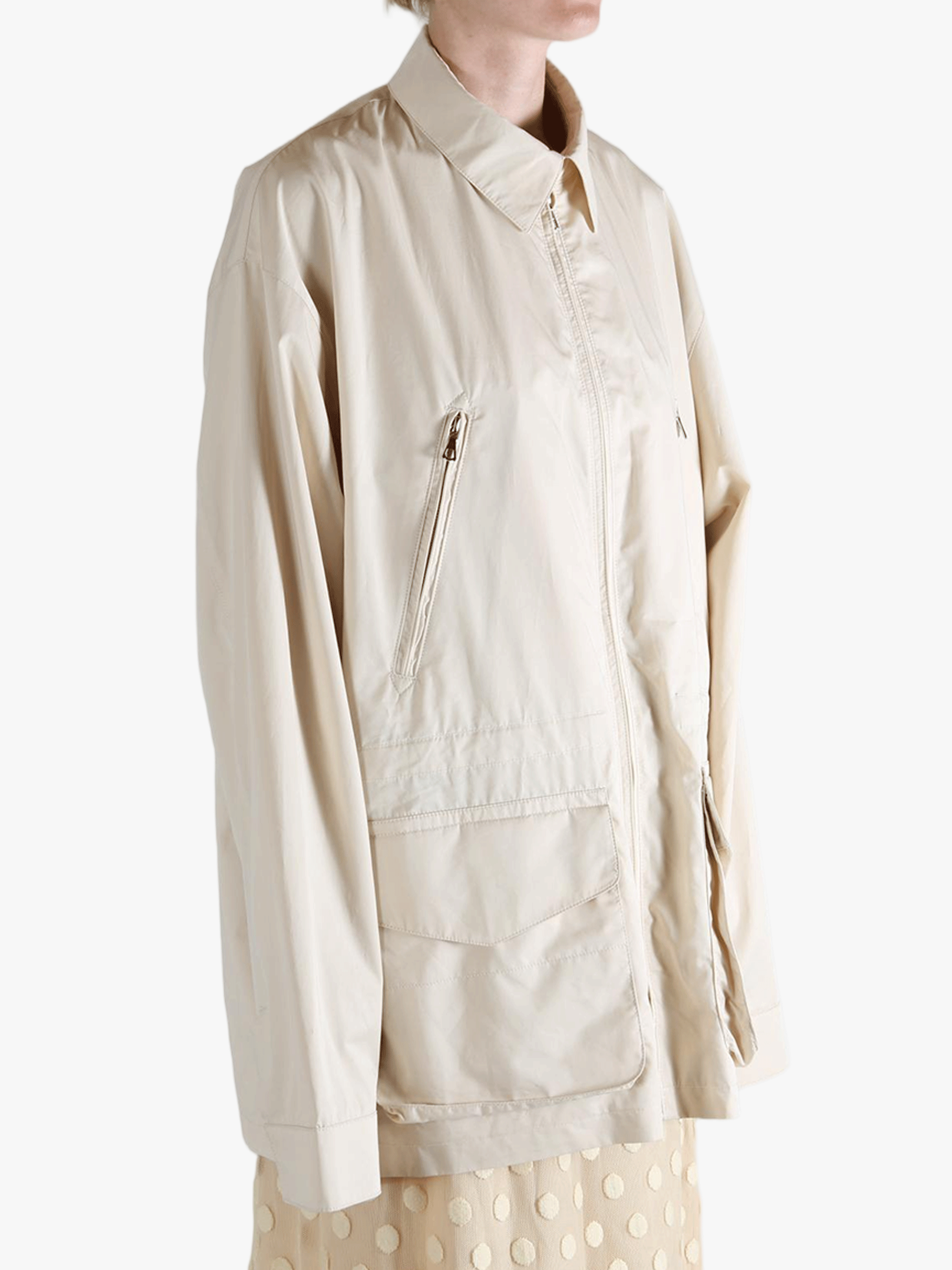 White jacket worn by a person, showing the jacket's fit