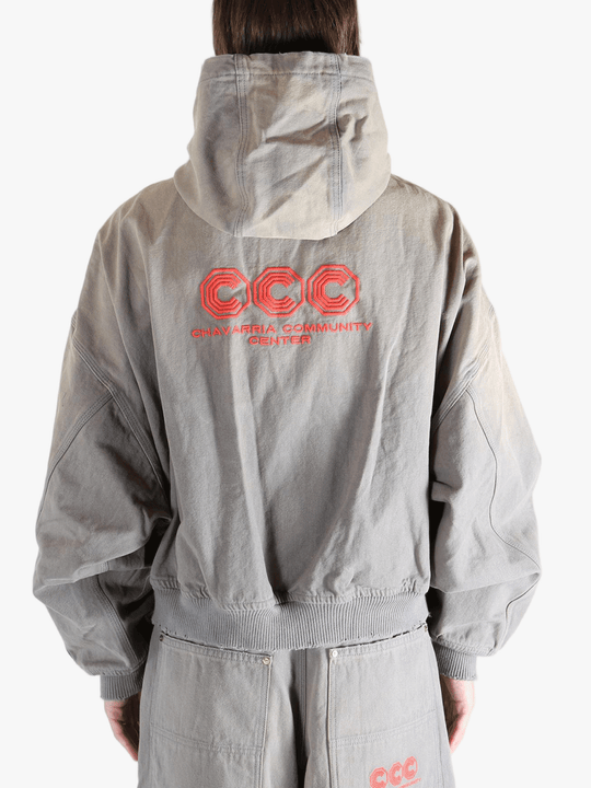 Grey hoodie, worn by a person, showing the hoodies fit