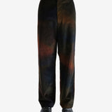 Black pants worn by a person, showing the pants's fit