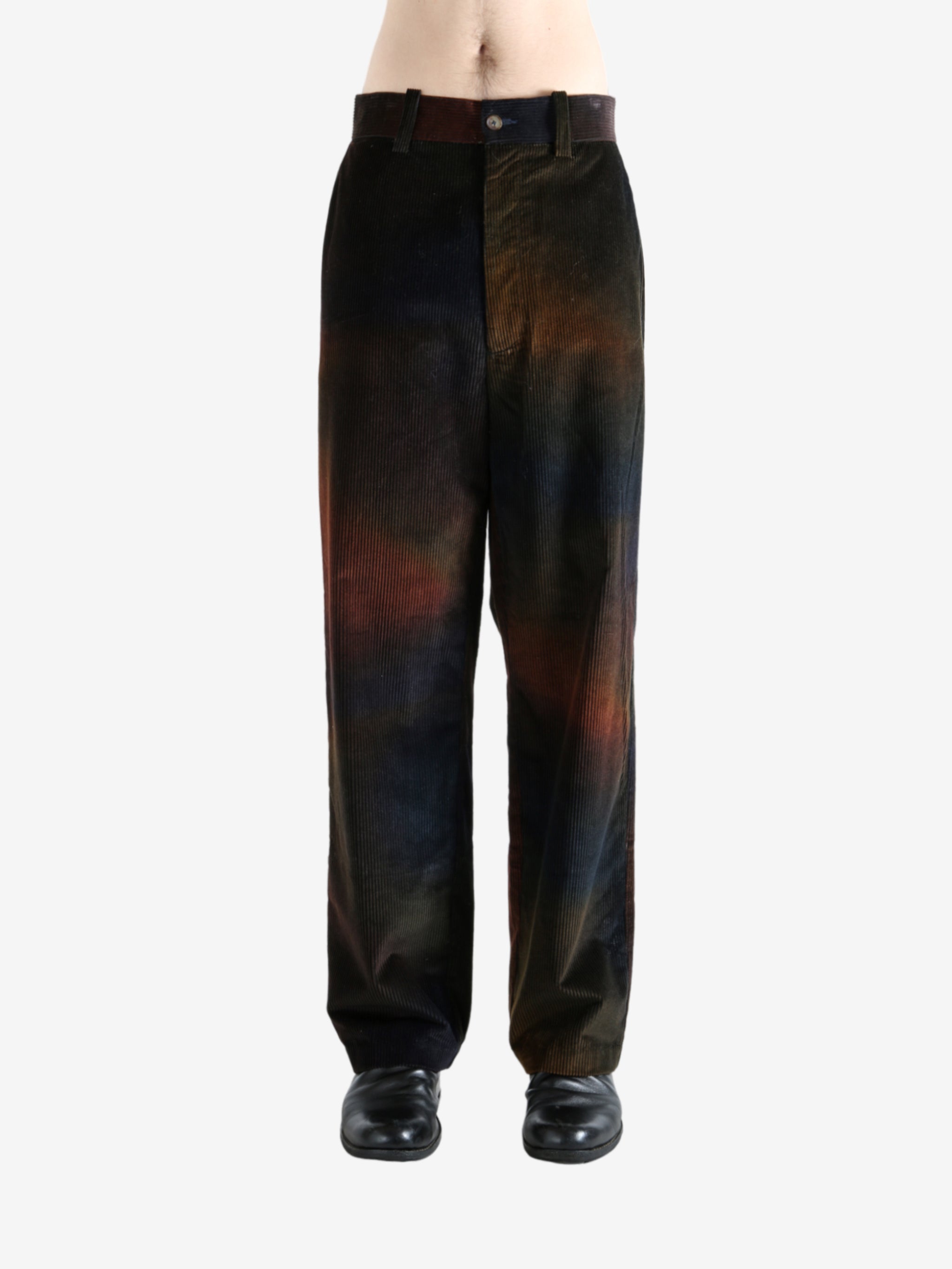 Black pants worn by a person, showing the pants's fit