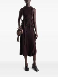 Burgundy dress worn by a person, showing the dress’ fit