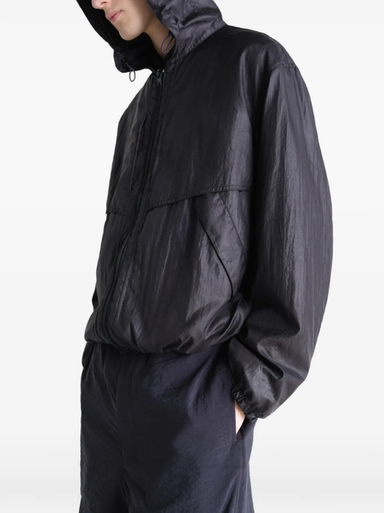 Black jacket worn by a person, showing the jacket fit
