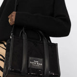 Black bag worn by a person, showing the bag's fit
