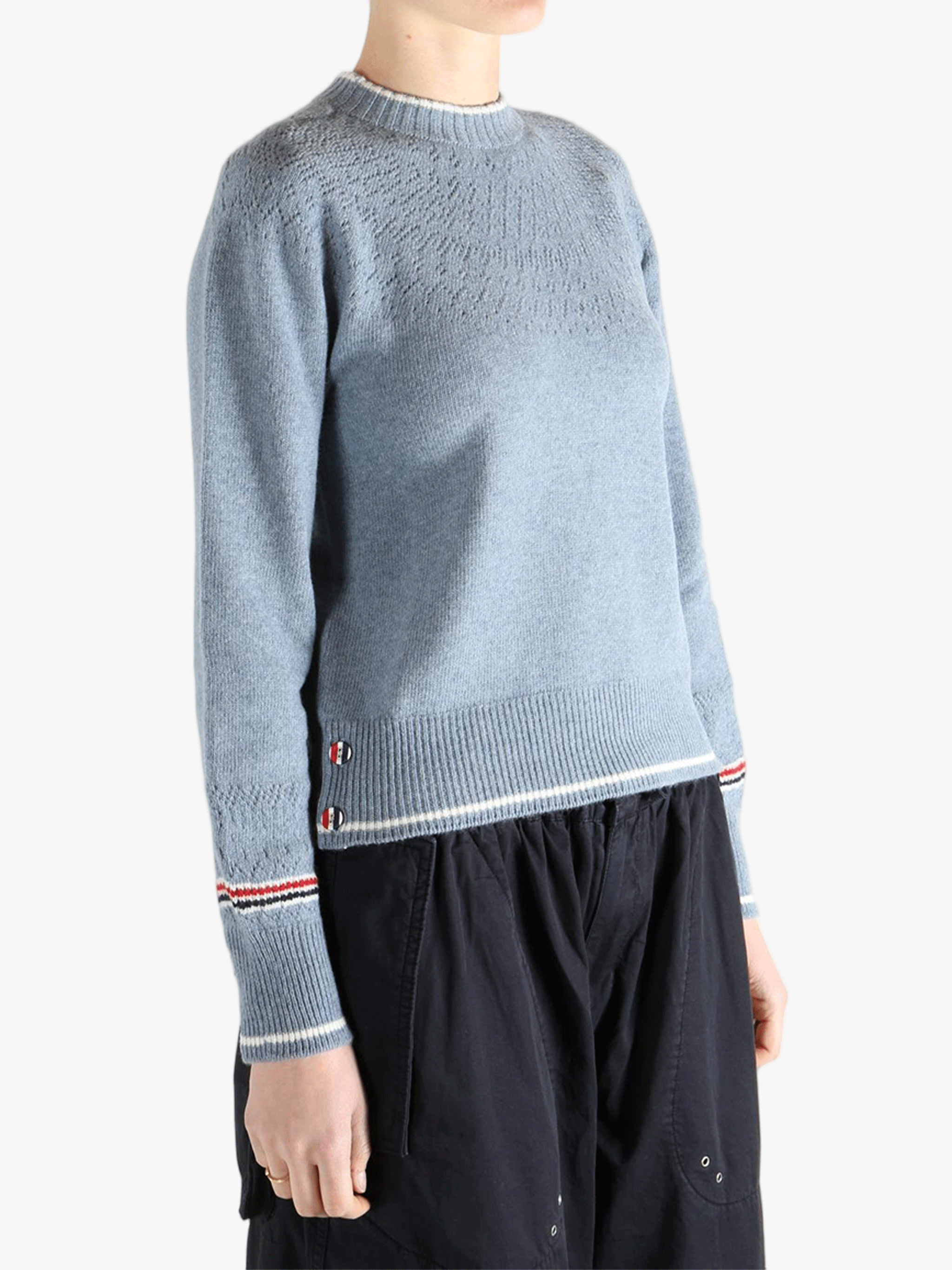 Blue pullover worn by a person, showing the pullover's fit