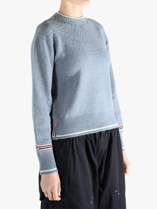 Blue pullover worn by a person, showing the pullover's fit