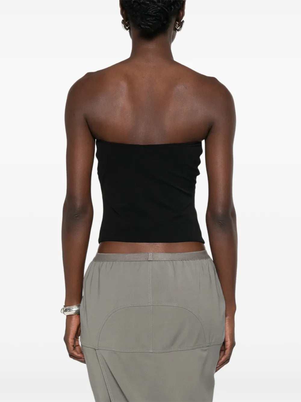 Black top worn by a person, showing the top fit