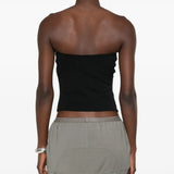 Black top worn by a person, showing the top fit
