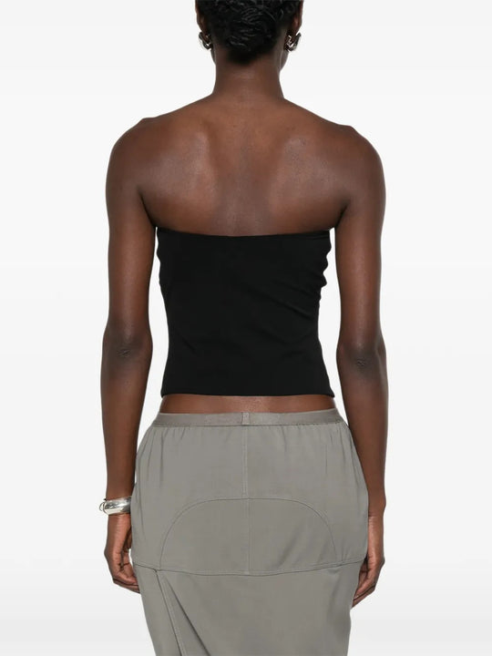 Black top worn by a person, showing the top fit