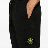 Black pants worn by a person, showing the pants fit