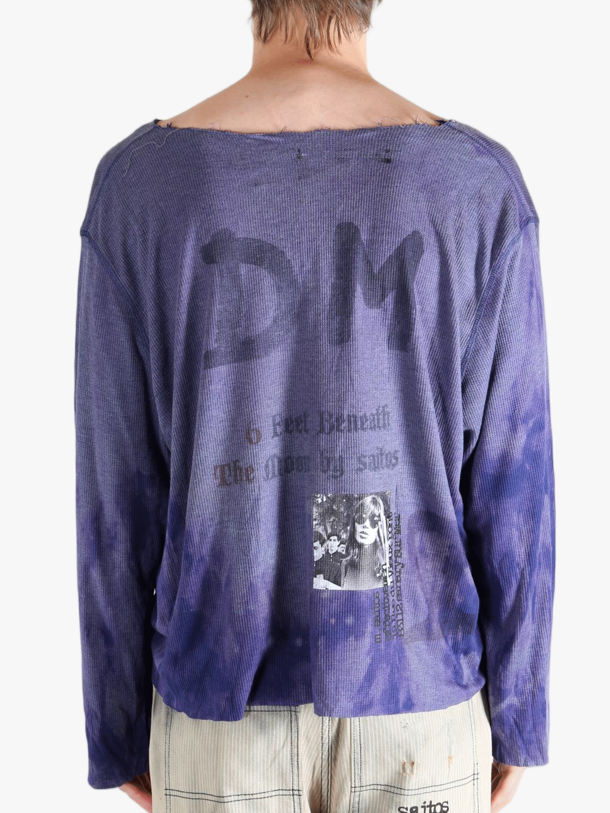 Purple top worn by a person, showing the tops fit