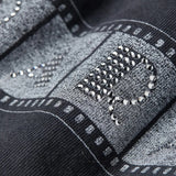Close-up of black t-shirts, showing the texture of cotton fabric