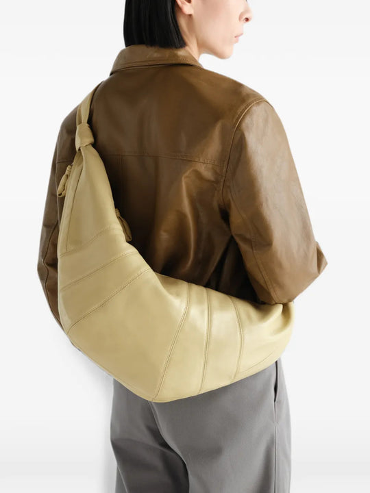 Tan bag worn by a person, showing the bag fit