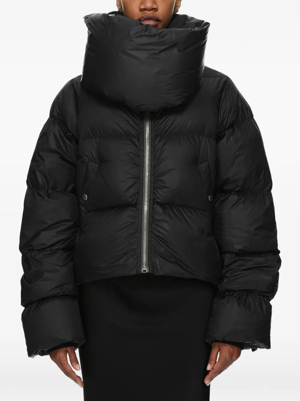 Black jacket worn by a person, showing the jacket fit