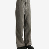 Brown pants worn by a person, showing the pants' fit