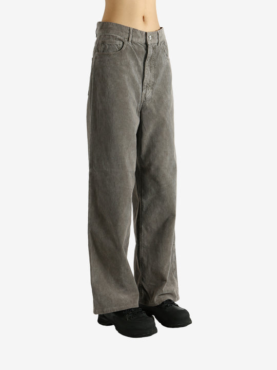 Brown pants worn by a person, showing the pants' fit