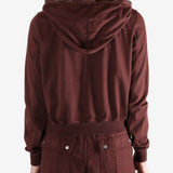 Burgundy hoodies worn by a person, showing the hoodies fit