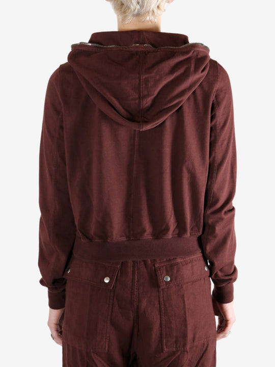 Burgundy hoodies worn by a person, showing the hoodies fit