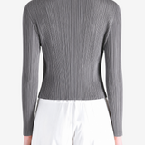 Grey knitwear worn by a person, showing the knitwear fit