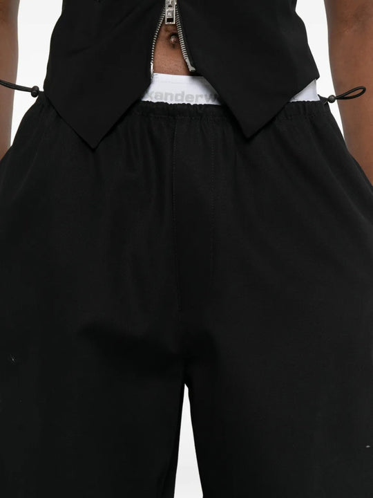 Close up black pants, showing texture of the cotton fabric