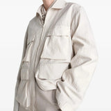 White jacket worn by a person, showing the jacket's fit