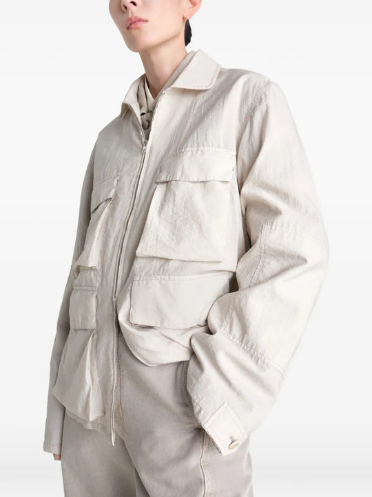 White jacket worn by a person, showing the jacket's fit