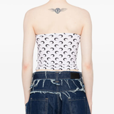 White tops worn by a person, showing the tops fit