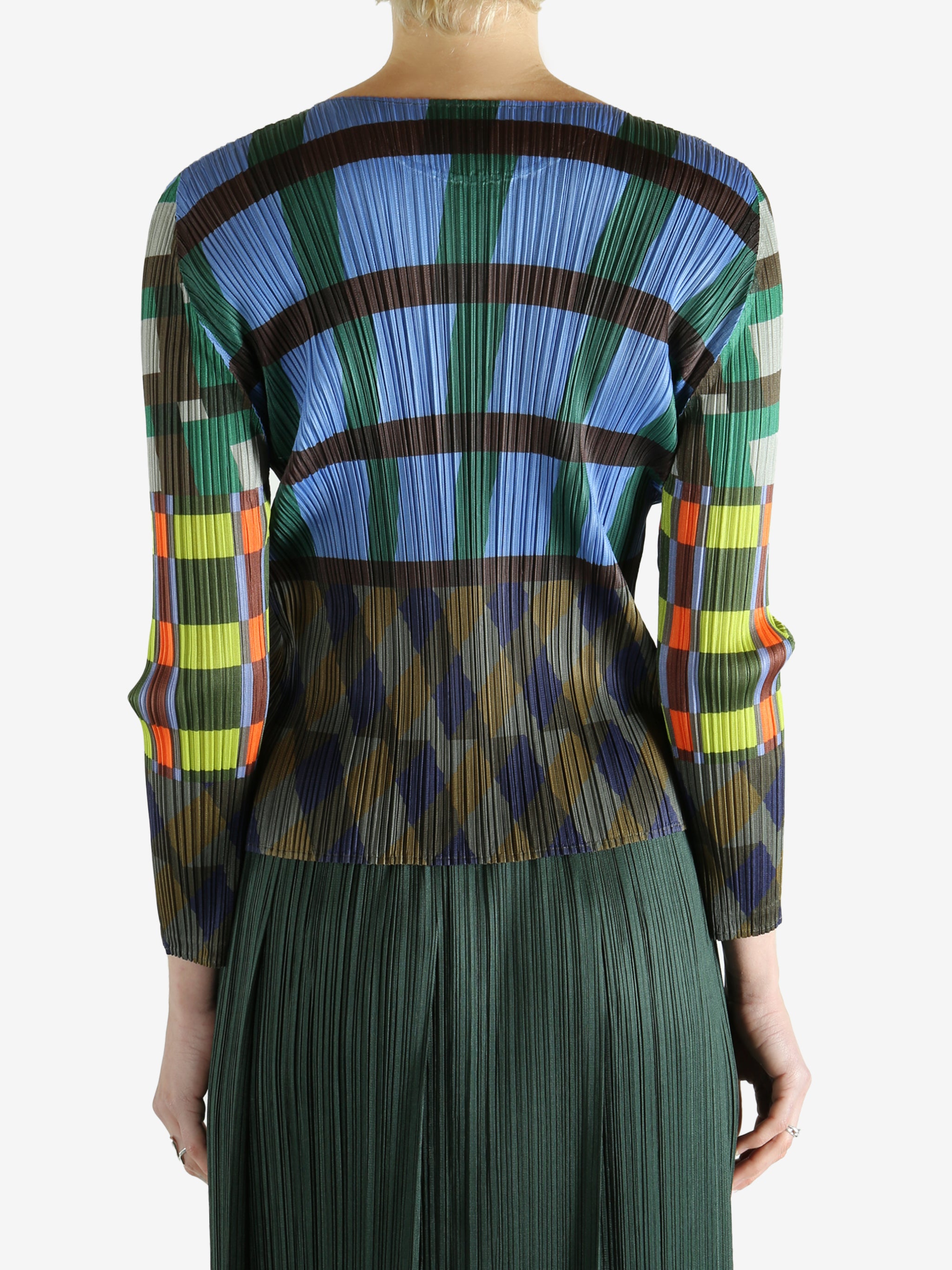 Blue top worn by a person, showing the top's fit