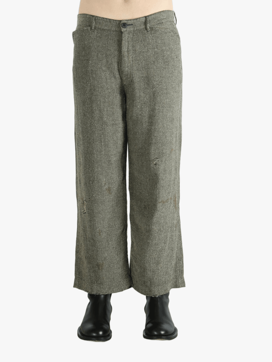 Grey pants worn by a person, showing the pants fit