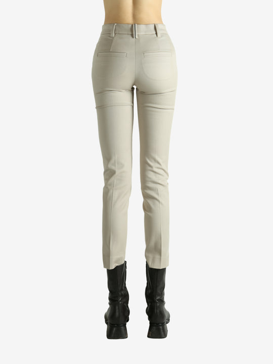 Tan pants worn by a person, showing the pants fit