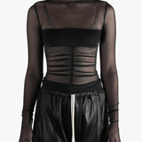 Black top worn by a person, showing the top's fit