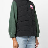 Black vest worn by a person, showing the vest's fit