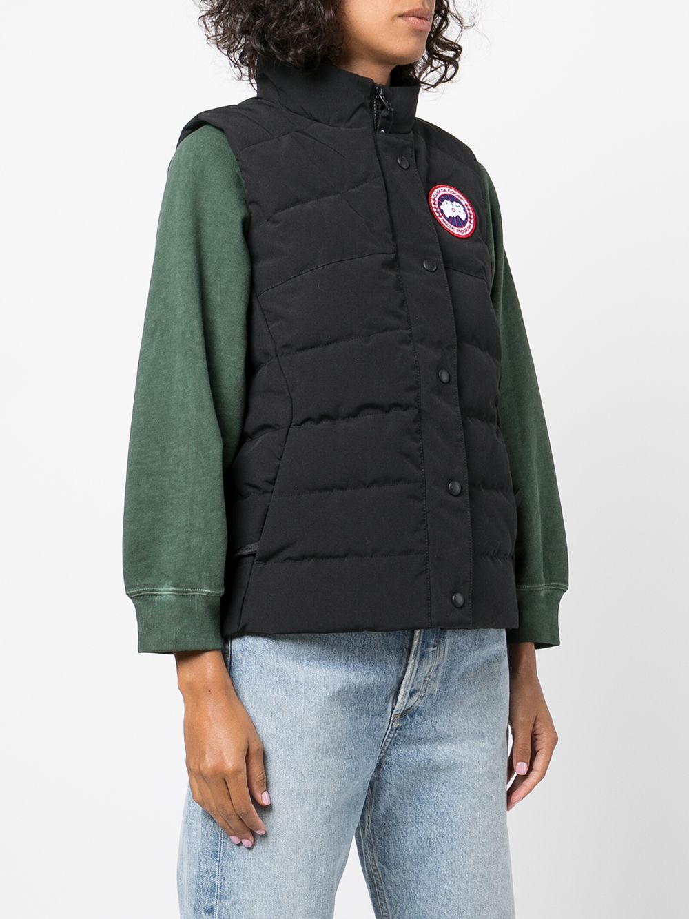 Black vest worn by a person, showing the vest's fit